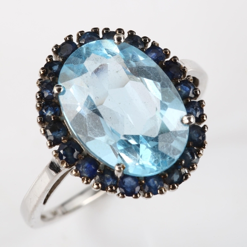 333 - A modern 9ct white gold blue topaz and sapphire cluster ring, setting height 18mm, size R, 4.6g