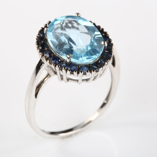 333 - A modern 9ct white gold blue topaz and sapphire cluster ring, setting height 18mm, size R, 4.6g