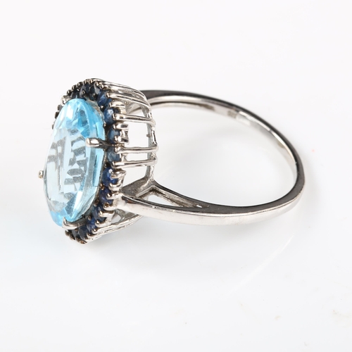 333 - A modern 9ct white gold blue topaz and sapphire cluster ring, setting height 18mm, size R, 4.6g