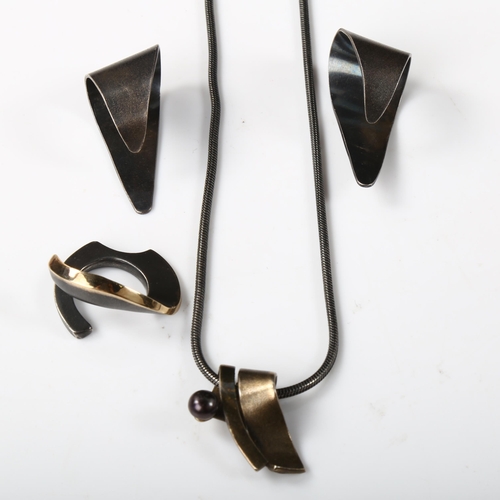 344 - A group of Danish oxidised and gilded sterling silver jewellery, comprising pendant necklace, ring a... 