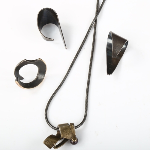 344 - A group of Danish oxidised and gilded sterling silver jewellery, comprising pendant necklace, ring a... 