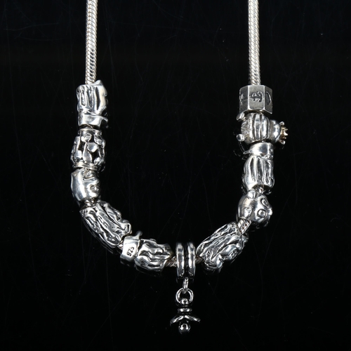 348 - PANDORA - a modern sterling silver snake link charm necklace, with 11 silver charms, necklace length... 