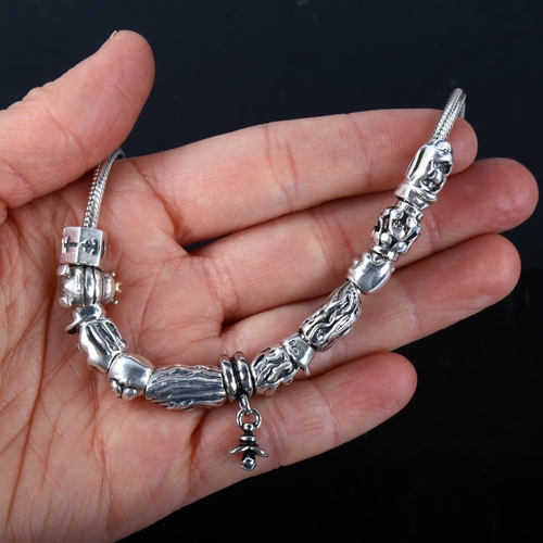 348 - PANDORA - a modern sterling silver snake link charm necklace, with 11 silver charms, necklace length... 