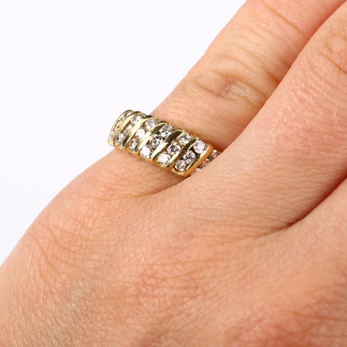 372 - A modern diamond band ring, unmarked gold settings test as 18ct, set with modern round brilliant-cut... 