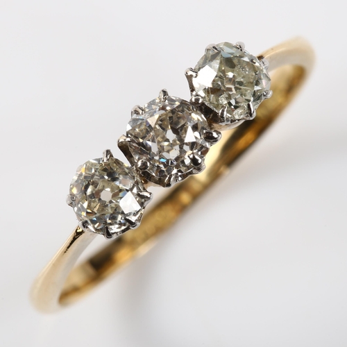 384 - An early 20th century 18ct gold three stone diamond ring, set with old-cut diamonds, total diamond c... 