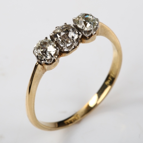 384 - An early 20th century 18ct gold three stone diamond ring, set with old-cut diamonds, total diamond c... 