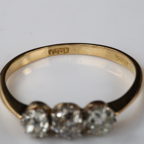 384 - An early 20th century 18ct gold three stone diamond ring, set with old-cut diamonds, total diamond c... 