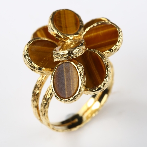 386 - A 1970s 18ct gold tigers eye abstract ring, allover textured settings, maker's marks indistinct, imp... 