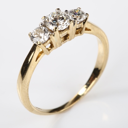 391 - A modern 14ct gold three stone diamond ring, set with modern round brilliant-cut diamonds, total dia... 