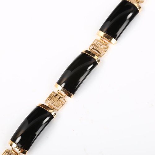 392 - A Chinese 14ct gold onyx panel bracelet, length 18cm, 13.5g