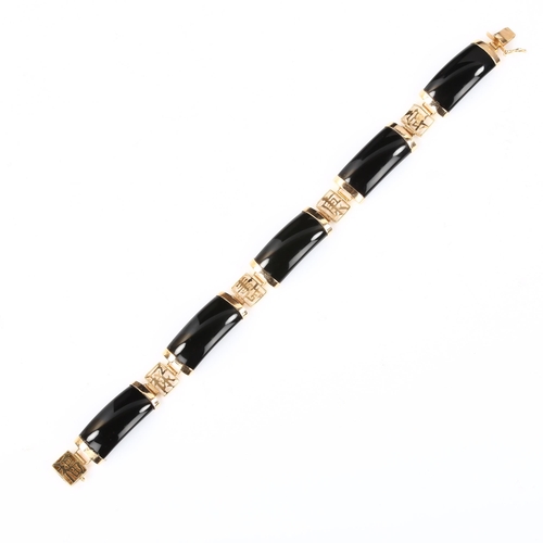 392 - A Chinese 14ct gold onyx panel bracelet, length 18cm, 13.5g