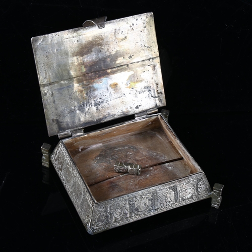 406 - A Peruvian silver Aztec casket, allover engraved decoration with totem legs, marked Peru 900, width ... 