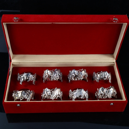 408 - FRAZER & HAWS - a set of 8 cast-silver figural raging bull napkin rings, diameter 5.5cm, each 1.8oz,... 