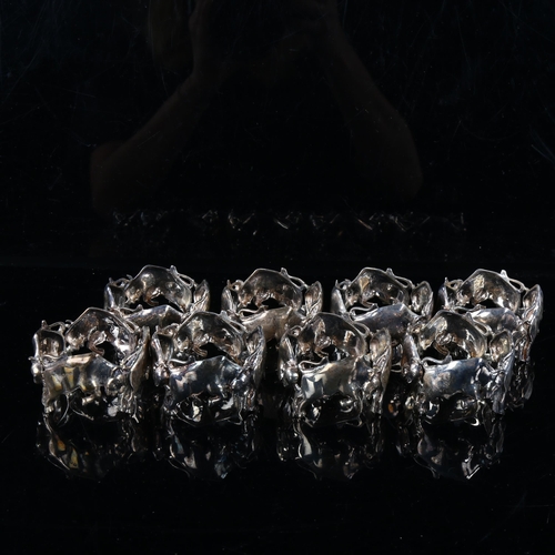 408 - FRAZER & HAWS - a set of 8 cast-silver figural raging bull napkin rings, diameter 5.5cm, each 1.8oz,... 