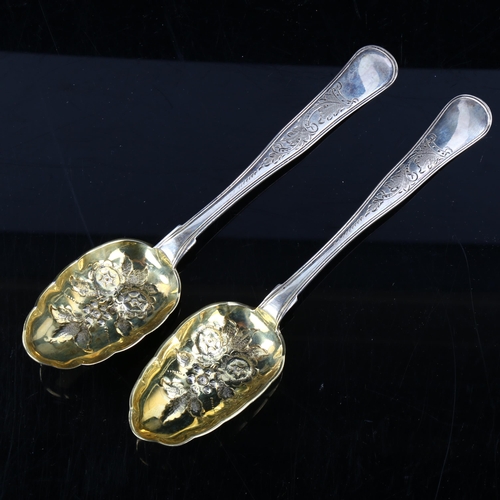 413 - A pair of Danish silver berry spoons, bright-cut engraved and relief embossed floral decoration with... 