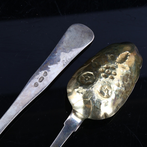 413 - A pair of Danish silver berry spoons, bright-cut engraved and relief embossed floral decoration with... 