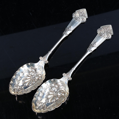 414 - ELKINGTON & CO - a pair of Victorian silver spoons, relief embossed bowls with floral handles, hallm... 