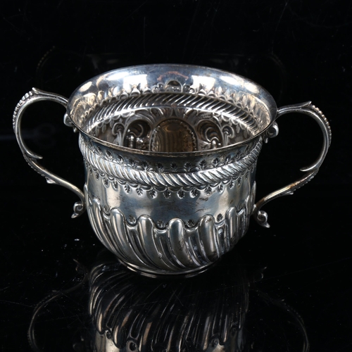 416 - A late Victorian silver 2-handled porringer, relief embossed half fluted decoration and rope twist g... 