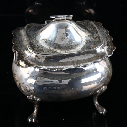 417 - An Edwardian silver tea caddy, oval bulbous form with scalloped rim and ring handles, by Boardman, G... 