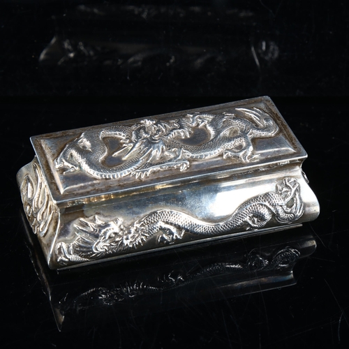 425 - A Chinese export silver dressing table ring box, relief cast dragon decoration, by Wang Hing, circa ... 