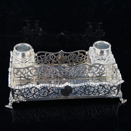 428 - A Victorian silver desk ink stand, rectangular form, with gadrooned rim and pierced floral gallery, ... 