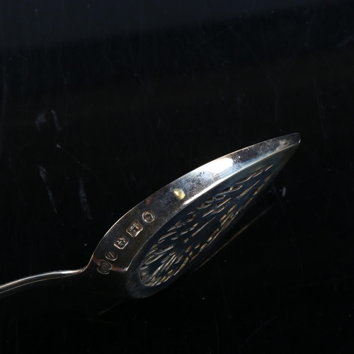 444 - A cased Victorian silver Old English pattern serving spoon, beaded edge with pierced and gilded bowl... 