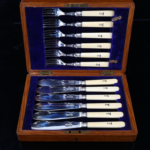 448 - A cased set of Edwardian silver-bladed ivory-handled fish cutlery for 6 people, with engraved Blackw... 