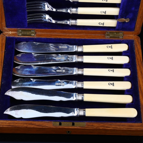 448 - A cased set of Edwardian silver-bladed ivory-handled fish cutlery for 6 people, with engraved Blackw... 