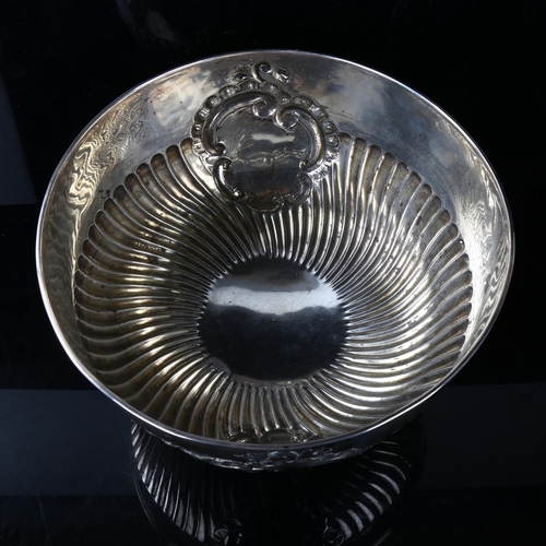 449 - A late Victorian silver pedestal punch bowl, relief embossed half fluted decoration, by George Natha... 