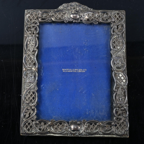 489 - MAPPIN & WEBB - a late Victorian silver-fronted rectangular photo frame, relief embossed and pierced... 