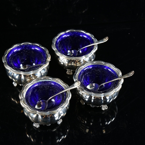 492 - A cased set of 4 Edward VIII silver salt cellars and spoons, lobed pumpkin form, with foliate shell ... 