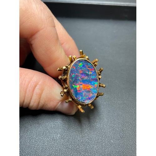 168 - A late 20th century 18ct gold black opal doublet abstract ring, with a cuboid tube basket and textur... 