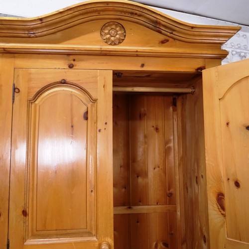 2071 - A polished pine 2-door wardrobe with drawer fitted base, W102cm, H215cm, D62cm