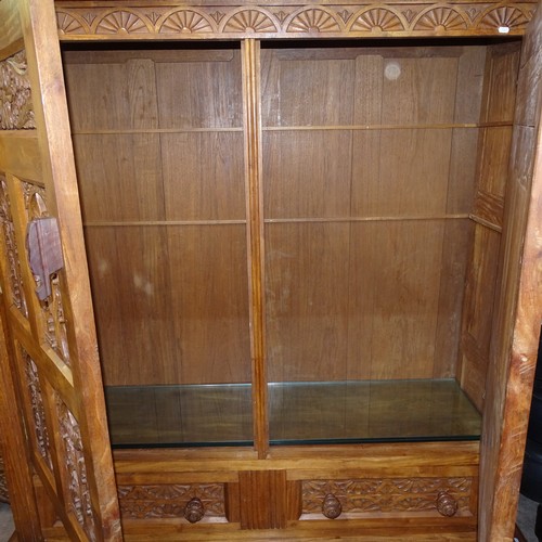 2297 - An Anglo-Indian teak and camphorwood cabinet, with 2 panelled doors and relief carved drawers under,... 