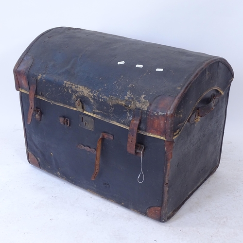 2298 - A Victorian leather-bound dome-top trunk, with fitted tray, W77cm, H61cm, D55cm