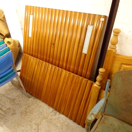 2501 - A 1950s teak single bed with rails, the headboard having inset fitted lights