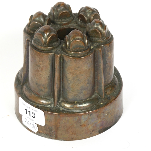 113 - A Victorian copper jelly mould, by Benham & Froud, with orb and cross mark, no. 481, diameter 12.5cm... 