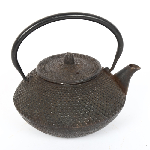 117 - A Japanese Kiyoko black cast-iron teapot, with strainer liner, diameter 15cm