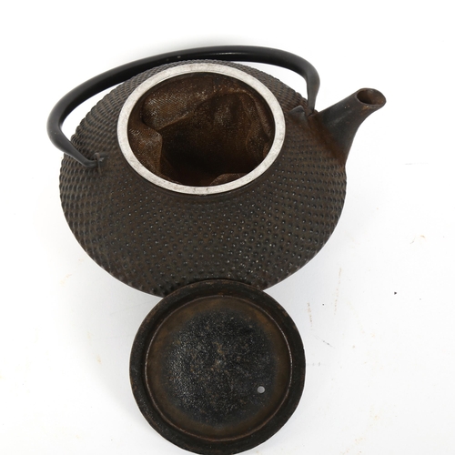 117 - A Japanese Kiyoko black cast-iron teapot, with strainer liner, diameter 15cm