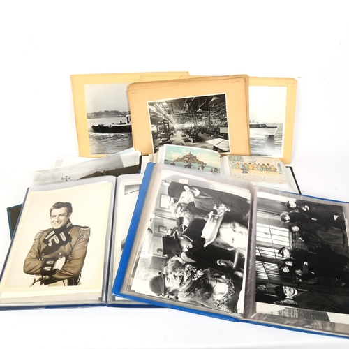 129 - Albums of Vintage movie star portrait photographs, topographical postcards, warship and boating phot... 