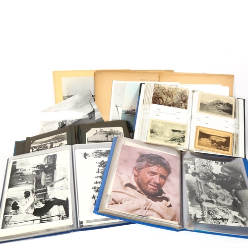 129 - Albums of Vintage movie star portrait photographs, topographical postcards, warship and boating phot... 