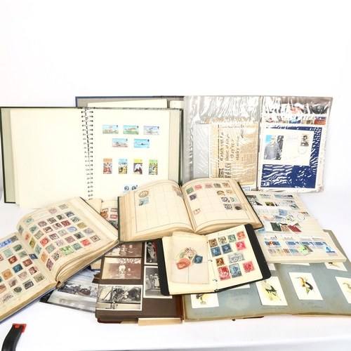 131 - A quantity of postage stamp albums and world stamps