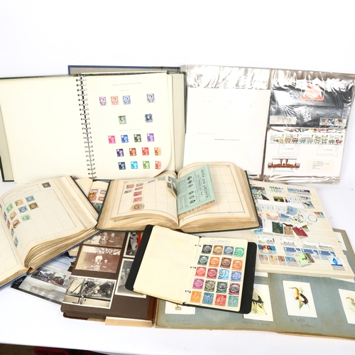 131 - A quantity of postage stamp albums and world stamps