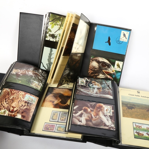 132 - 3 albums of WWF First Day Covers and postage stamps