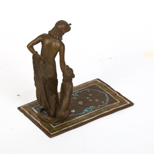 156 - Bergmann style cold painted bronze female nude with panther on Persian rug, height 16cm