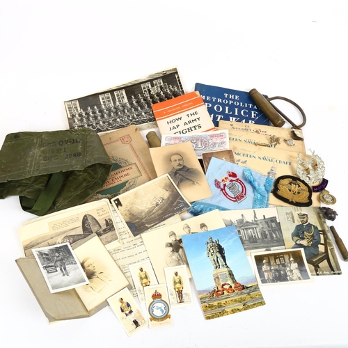 171 - Various war-related ephemera, including Metropolitan Police At War booklet, steel handcuff, Bydand c... 