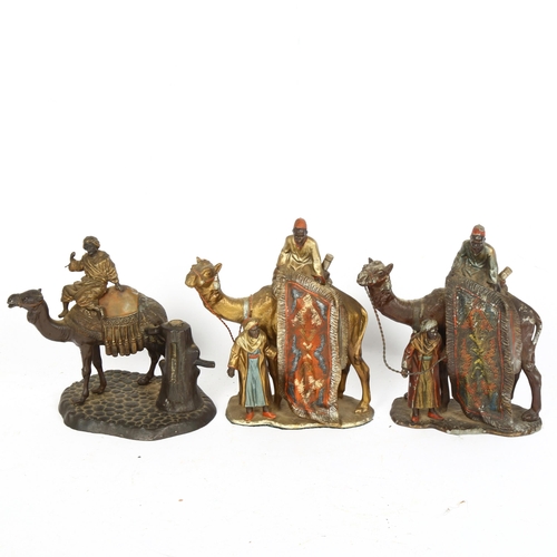 174 - 3 Austrian cold painted spelter table lighters, in the form of a camel and rider, height 16cm