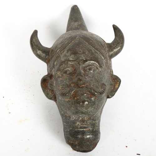 180 - An Antique patinated bronze demon head sculpture, height 16cm