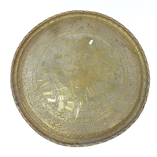 2019 - An Indian circular brass tray-top table on folding base, D67cm, H57cm