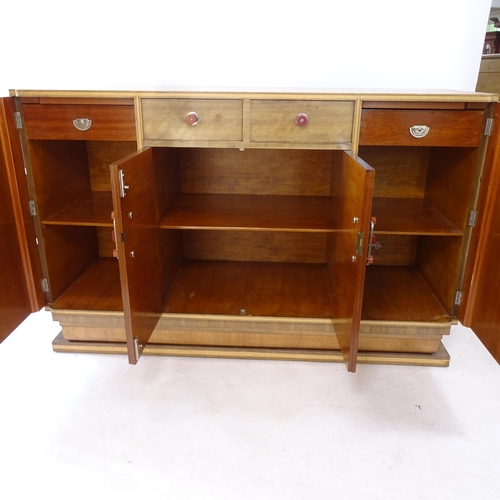 2062 - A mid-century mahogany sideboard, with 2 frieze drawers, and 4 cupboards doors revealing fitted inte... 